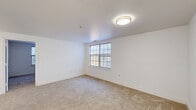Located at 2101 Reamer Dr in Barrington, NJ, this 2-bedroom, 1-bathroom unit offers a well-organized single-floor layout designed for efficient everyday living. The kitchen is a standout space, featuring white shaker-style cabinetry with gold hardware, a stainless steel refrigerator, a black range, a gold-toned sink faucet, and light wood-look vinyl flooring. A stylish multi-bulb gold chandelier adds a modern touch overhead. Notably, an in-unit washer is conveniently tucked into the kitchen area. Both bedrooms are carpeted and finished with crisp white walls, offering a clean and neutral palette. Each room features windows with blinds that invite natural light and provide views of surrounding greenery. Closet space is available in the bedrooms, with doors featuring classic gold hardware. The bathroom is neatly appointed with a white vanity, a medicine cabinet mirror, light wood-look vinyl flooring, and a glass-door shower/tub combination. Accessibility-friendly grab bars are also present. Throughout the unit, clean white walls, consistent flooring choices, and simple finishes create a cohesive and functional living environment.