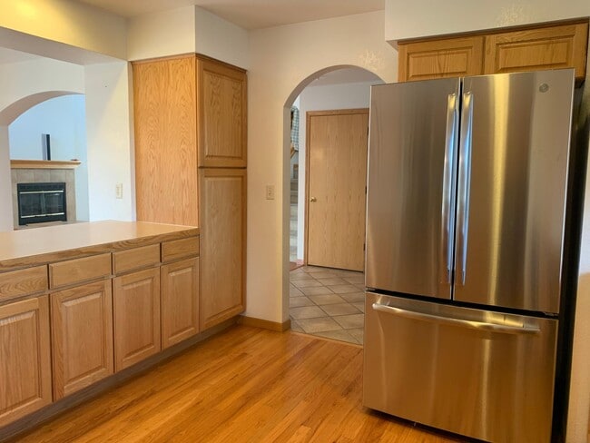 Kitchen island and SS Refrigerator - 2232 Sweetwater Creek Dr