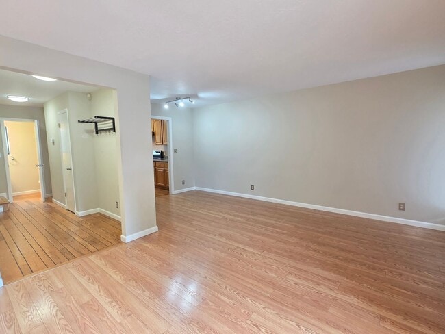 Building Photo - Spacious 2BR Condo with Central A/C, Bonus Room & Huge Storage – Walk to Burlingame Avenue