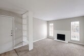 This 700 square foot apartment in Houston, TX offers a well-designed living space with two bedrooms and two bathrooms. The layout maximizes functionality within its compact footprint. The modern kitchen features white cabinetry, light-colored countertops, and stainless steel appliances, creating a bright and efficient cooking area. The living room is enhanced by a sleek fireplace and large windows that flood the space with natural light. Plush carpeting in the bedrooms and living areas adds warmth and comfort. The bathrooms are updated with contemporary fixtures and vanities. Throughout the apartment, a neutral color palette of whites and grays creates a clean, cohesive look. The primary bedroom, measuring 160 square feet, provides ample space for rest and relaxation. Built-in closets and shelving units offer practical storage solutions. The apartment's design emphasizes openness and light, making the 700 square feet feel spacious and inviting.