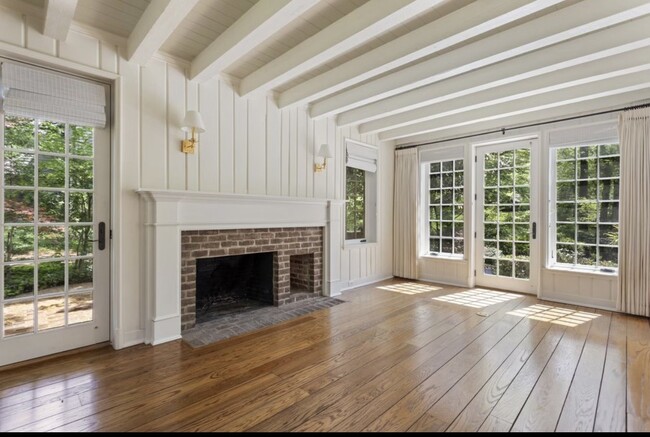 Wood burning fireplace in living room. - 123 Clarendon Ave