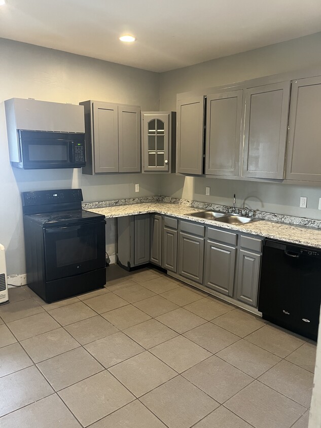 Large kitchen with all appliances including a microwave and dishwasher - 94 Woodford St