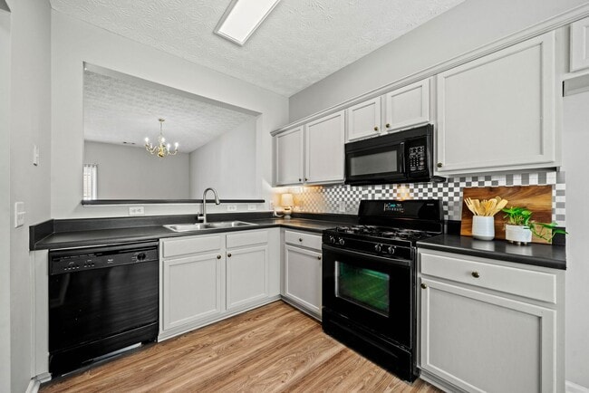 Building Photo - 3-bedroom, 2.5-bath end-unit townhome in the Garrison Square