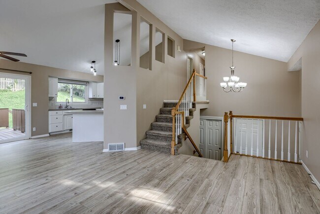 Building Photo - Open Layout with Fenced Yard & Great Locat...