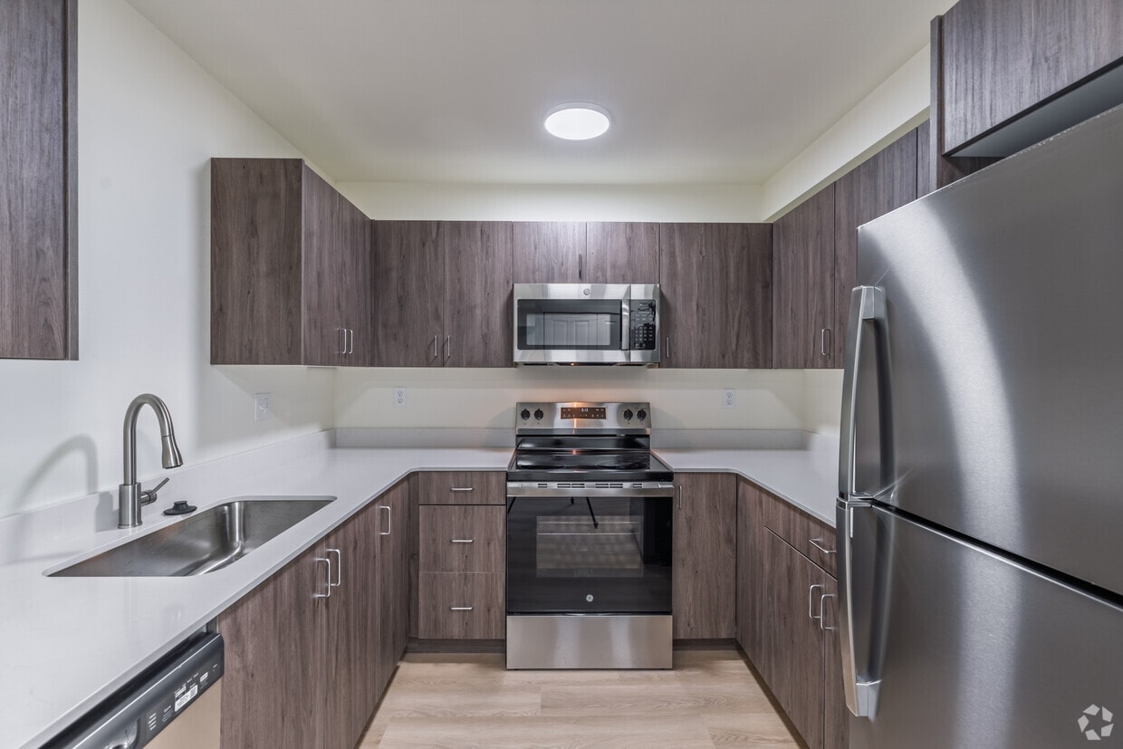 3BR, 2BA - 877SF - Kitchen - Brand New Apartments for Rent | 1, 2 & 3 Bedrooms Available | Covered Parking + Patios - ONE MONT...