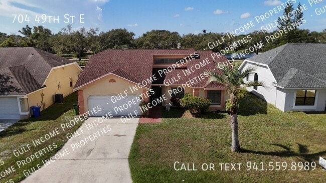 Photo - 704 49th St E House