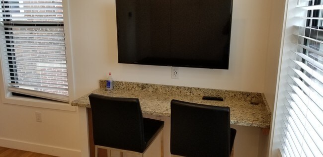 TV with Desk and chairs area - 9 6th St