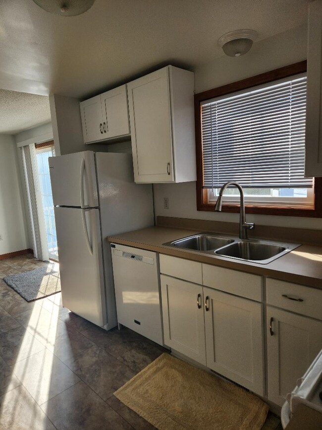 New Kitchen appliances, flooring, cabinets, counter top, sink and widow blinds. - 6568 Ward Rd