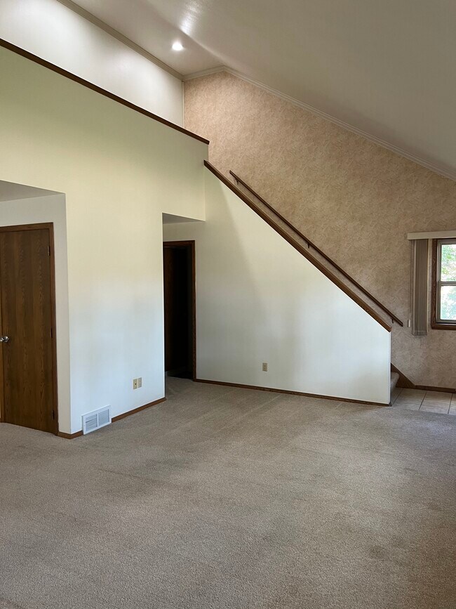 Stairway to upper level - 1226 E Longview Dr