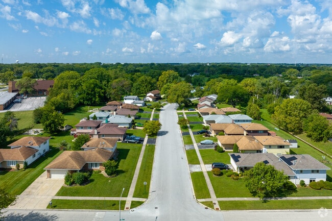 Country Club Hills offers spacious lots and meticulously maintained lawns.