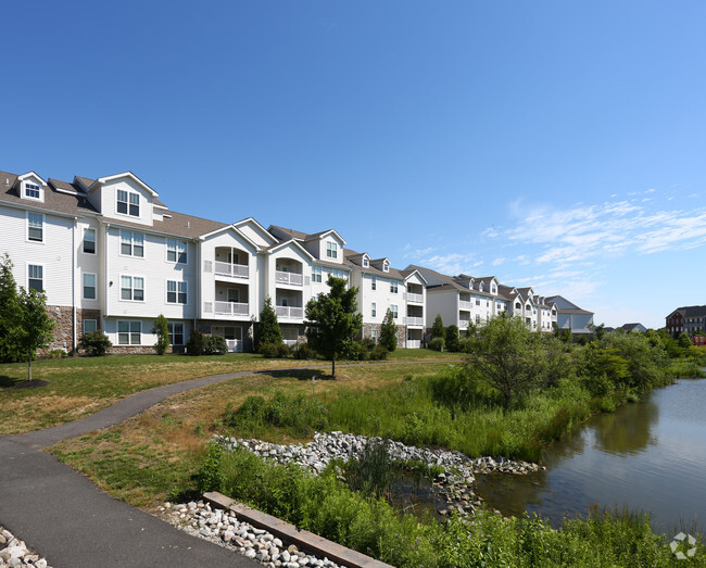 Walking paths and ponds - Meridian Crossing Apartment Homes