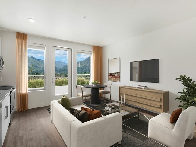 Sala de estar y cocina urbanas en los apartamentos Richmond en Millcreek - The Richmond Apartments