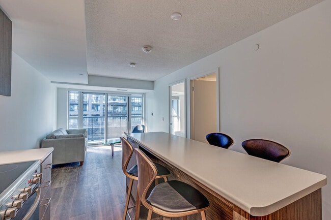 Building Photo - One Plus Den Furnished unit