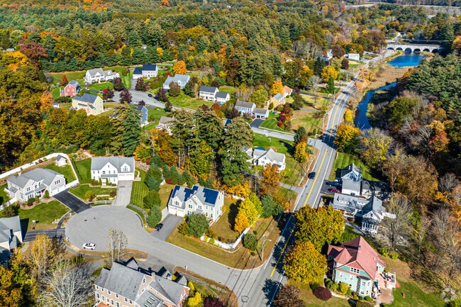 Homes sit on beautiful, tree-lined streets.