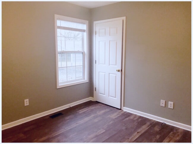 Bedroom 2 freshly painted and new flooring. - 216 Winters St