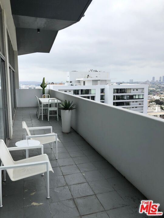Large balcony run entire length of the unit - 1155 N La Cienega Blvd