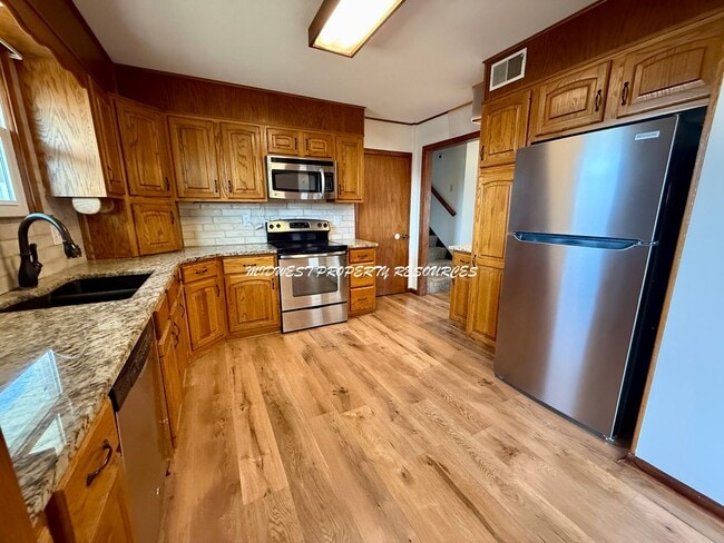 Building Photo - Spacious 3 Bedroom Home with Finished Lower Level & Large Fenced Yard