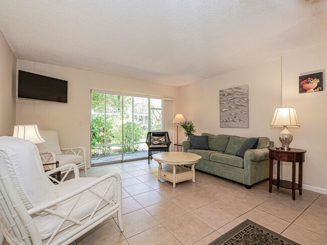 Living Room Opening to Screen Porch - 1901 Indian River Blvd