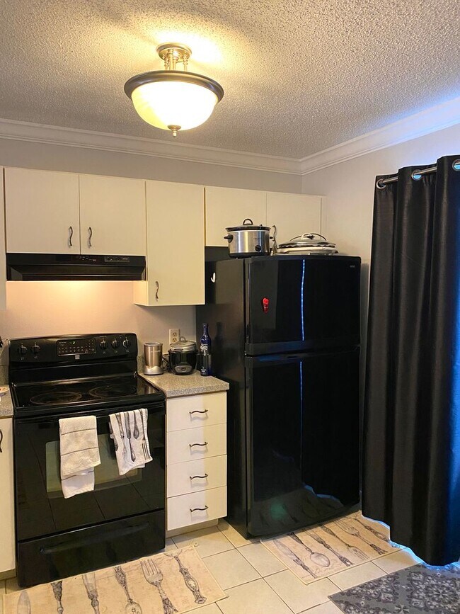 Building Photo - Romantic 1BR/1BA Top-Floor Condo with Garden Tub & Scenic Balcony Views – Dockside Orlando