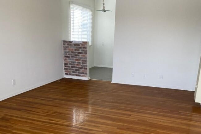 living room towards kitchen. 1/2 brick wall - 2210 24th St