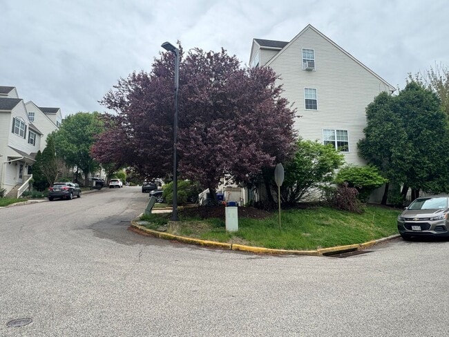 Building Photo - Stunning 3–4 Bedroom Townhome in Private Community | Garage + EV Charger | Deck with Tree Views