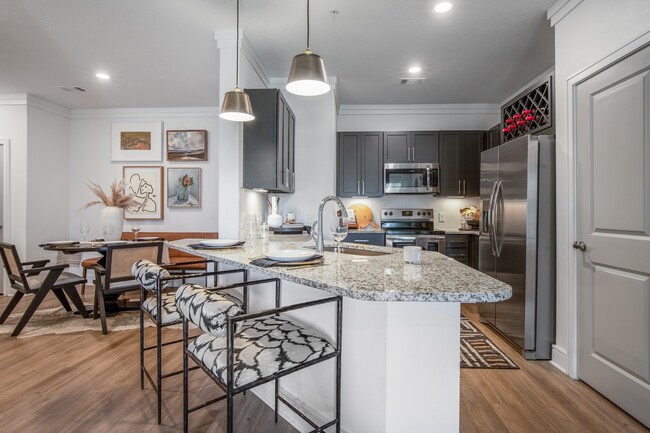 Large Kitchen with view of Cozy Dining Area - Cyan Mallard Creek Apartments