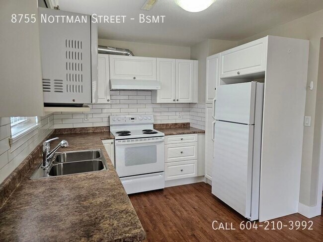 Photo du bâtiment - Spacious Above Ground Suite + Office