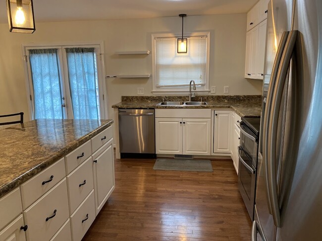 kitchen with dishwasher and double sink - 3705 Pfost Ave