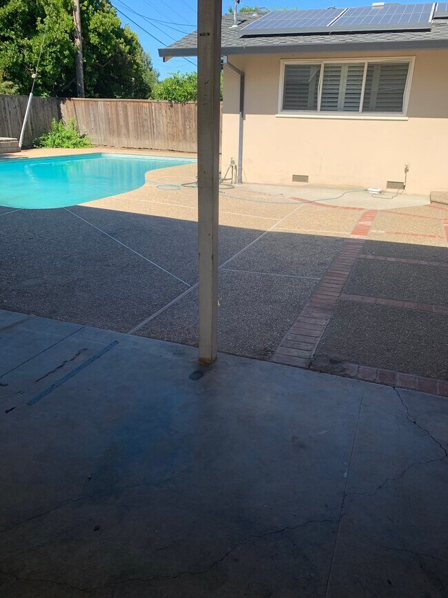 Covered Patio with ceiling fan and recessed lights outdoors - 1510 Cameron Way