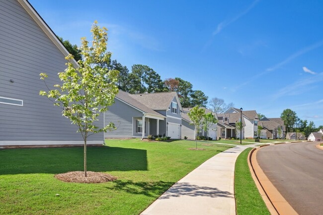 Exterior shot of Salem Oaks, two story homes with a private driveway and attached garage. - Salem Oaks