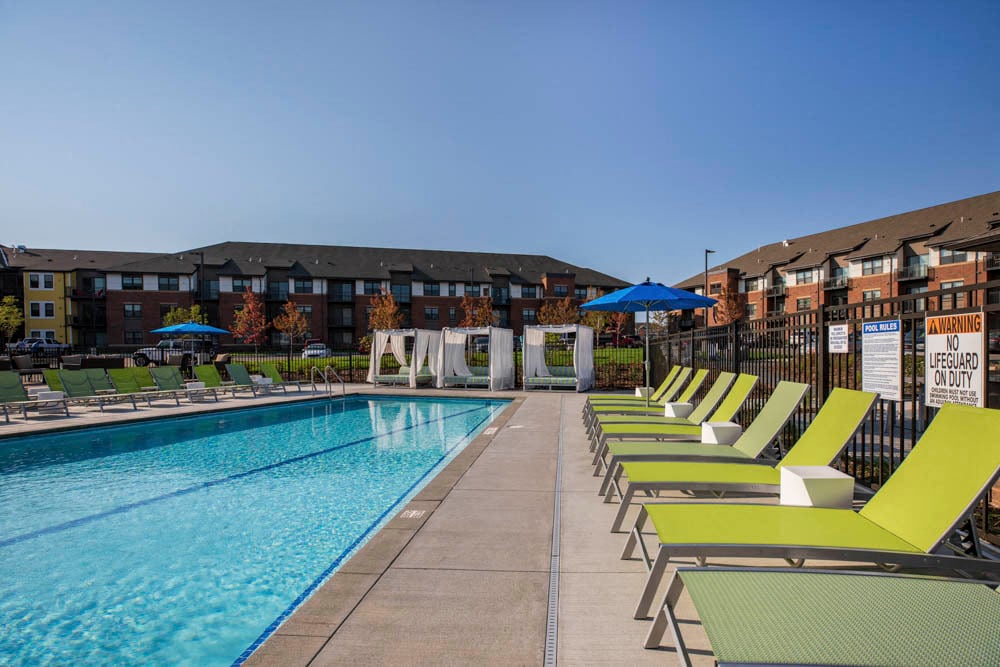 Soak up some sun after a long day with our private swimming pool, lounge chairs and resort-style cabanas. - Ascend at Woodbury