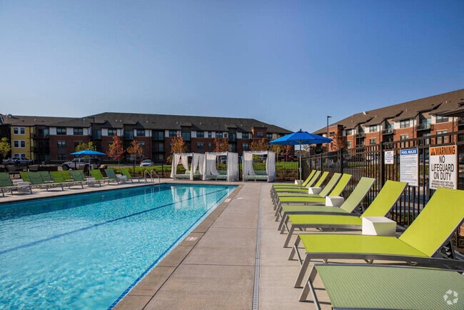 Soak up some sun after a long day with our private swimming pool, lounge chairs and resort-style cabanas. - Ascend at Woodbury