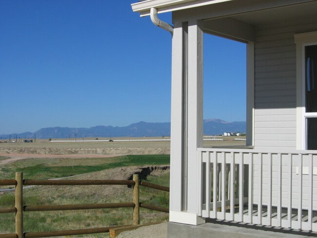 Front yard view of golf corse and Front Range of the Rockies - 9904 Antler Creek Dr