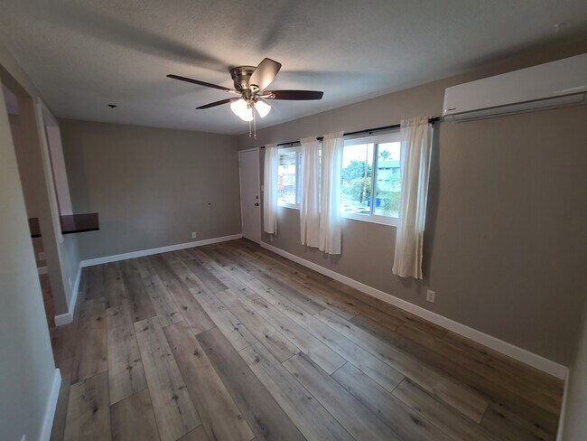 living room with new A/C unit - 1352 Helix St