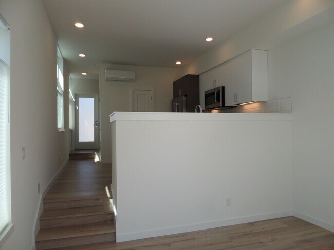 Building Photo - Newer & STUNNING Two Bedroom + Den Condo w...