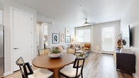 Located in Queen Creek, Arizona, this single-story, 2-bedroom, 2-bathroom home offers a thoughtfully designed open-concept layout that seamlessly connects the living, dining, and kitchen areas. Wood-look flooring flows throughout, lending warmth and visual continuity to every room.

The bright living room features a ceiling fan, large windows with blinds, and a glass door that fills the space with natural light and provides outdoor access. The adjacent dining area accommodates a full dining set, while the kitchen impresses with crisp white shaker cabinetry, white quartz countertops, stainless steel appliances including a dishwasher and refrigerator, and a window above the sink.

The primary bedroom is a comfortable retreat with a ceiling fan, large windows, and direct access to its en-suite bathroom. The primary bath includes a walk-in glass-door shower with built-in shelving and connects to a dedicated walk-in closet with built-in wire shelving. The second bedroom mirrors the airy aesthetic with natural light and ample space. Both bedrooms and bathrooms feature the same consistent wood-look flooring. Two closets provide organized storage throughout the home. The overall ambiance is clean, modern, and welcoming.