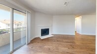 Located at 6701 Del Rey Ave in Las Vegas, NV, this single-level 3-bedroom, 2-bathroom residence offers a thoughtfully designed layout with consistent wood-style flooring flowing throughout every room. The open-concept living area is anchored by a classic white-mantled fireplace and features a textured ceiling, neutral tones, and access to a private balcony that brings in abundant natural light.

The kitchen is a standout feature, boasting white shaker cabinets, dark lower cabinetry, stainless steel appliances including a refrigerator, range, and microwave, a white quartz peninsula with an undermount sink, and recessed lighting overhead. The peninsula provides additional seating and workspace, seamlessly connecting the kitchen to the living area.

Each of the three bedrooms is bright and well-proportioned, with large windows fitted with blinds offering outdoor views and natural light. Bedrooms include built-in sliding closets with paneled doors for ample storage. The dedicated closet space adds further organizational convenience.

Both bathrooms are clean and functional, featuring tub-shower combos, white surrounds, wood-style flooring, light countertops, and stylish vanities—one with a navy blue cabinet. The overall ambiance is fresh, modern, and move-in ready.