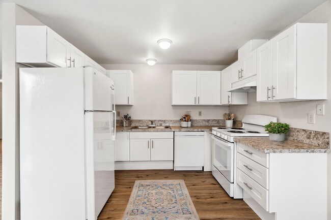 Experimente la excelencia culinaria en este espacio de cocina de impresionante diseño. - Stillwood Apartments