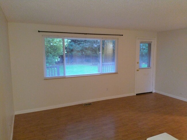 Photo - Charming updated 3 bed 1 bath ranch style home with double car garage and large fenced back yard.