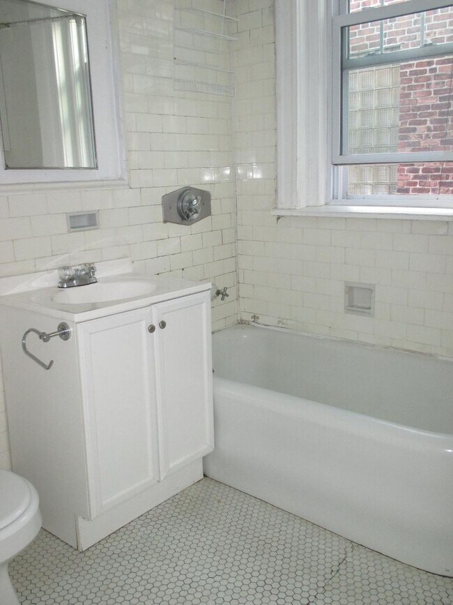 Photo - No brokers Fee, No Security Deposit, Heat, Hot Water Included, Steps from the T Stop Apartment