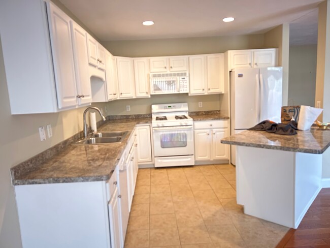 Kitchen with Island - 14 Hollyhock Knoll Ct