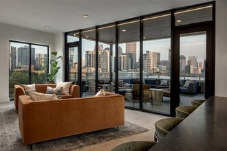 Rooftop lounge and patio with city skyline views - AMLI Atlantic Station