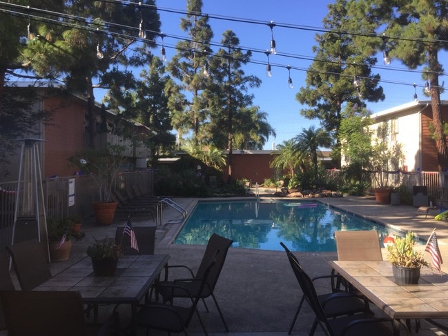 Beautiful pool with stringed lights at patio - Beachwood Village Apartments