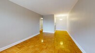 This efficient 480 square foot apartment in Toronto optimizes space with a thoughtful layout. The heart of the home is an open-concept living area, showcasing gleaming parquet hardwood floors that extend throughout the space. Large windows flood the room with natural light, while a sliding glass door leads to a private balcony offering urban views.

The 140 square foot bedroom comfortably accommodates a queen-sized bed and features a mirrored closet, maximizing the sense of space. The bathroom is modernly appointed with a white and black tile motif, a full-sized tub with shower, and a vanity with storage.

The apartment's neutral color palette, primarily in soft grays and whites, creates a serene ambiance. Baseboard heating units ensure comfort year-round. The property's single floor layout and efficient design make it an ideal urban dwelling, perfect for those seeking a low-maintenance lifestyle in the heart of Toronto.