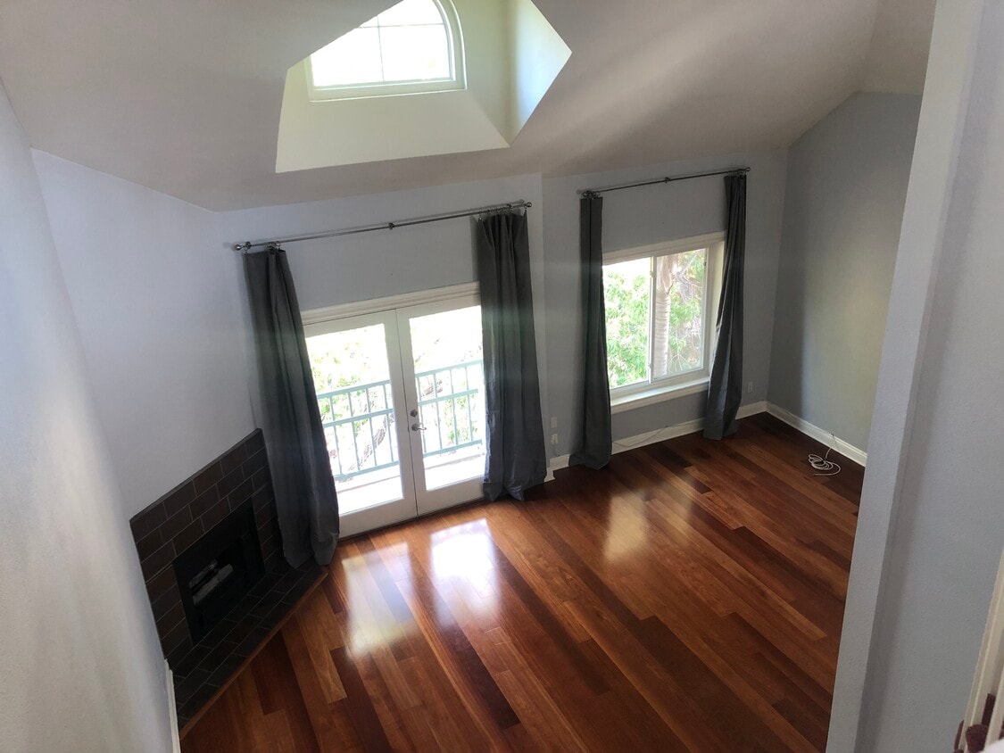 Living rm w French doors + blackout drapes - 13220 Valleyheart Dr
