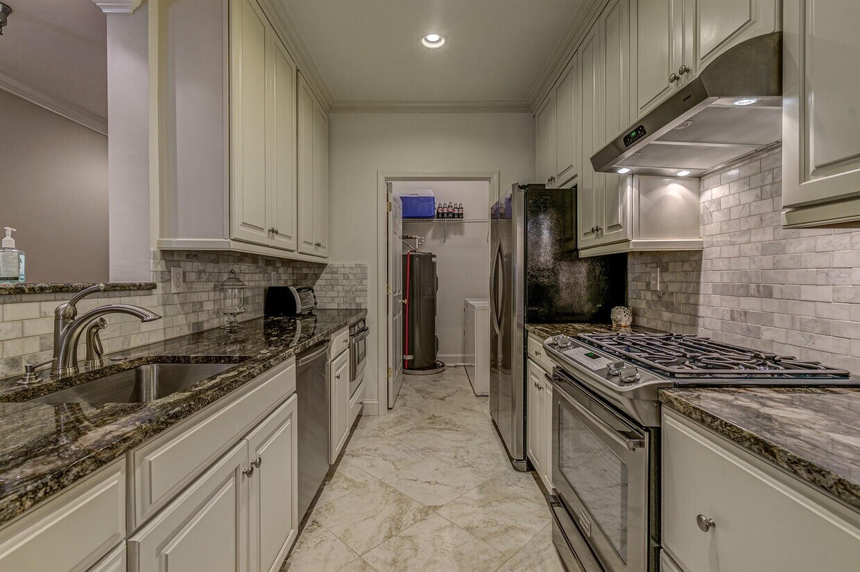 Kitchen with laundry in back. - 2220 Carolina Ave SW