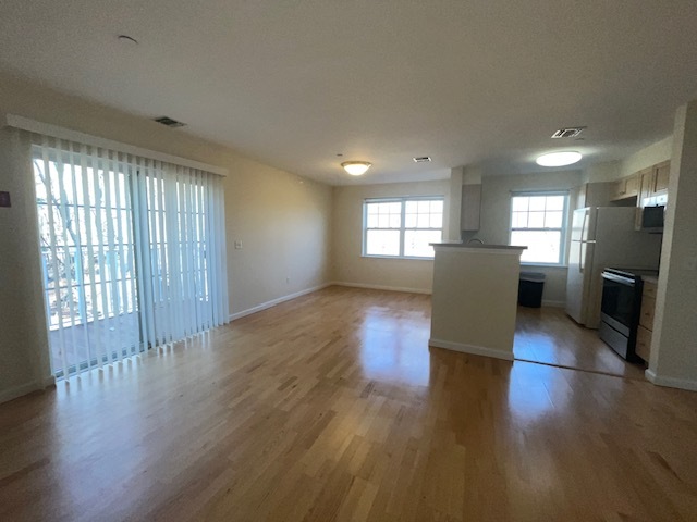 Sunny Living Room & Dining Area w/ Sliders to Terrace - 300 Woodcrest Ln