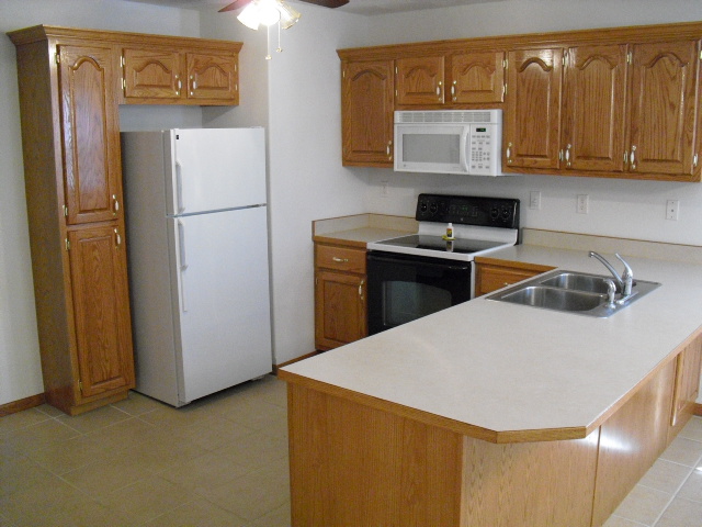 Fully equipped kitchen area in each apartment - 1305 Esry Dr