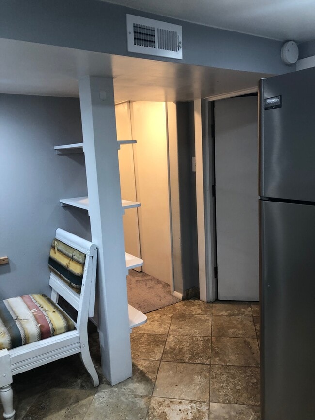 breakfast nook with floating shelves - 4155 N Raleigh St
