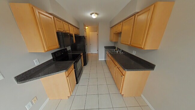 Foto del edificio - "2-Bed Condo Retreat in Clinton Township – Cozy Comfort Awaits!"